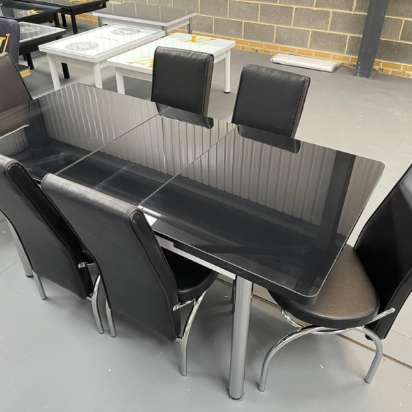 Elegant Black Dining Table with Silver Legs